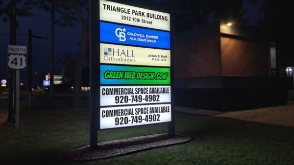 Triangle Park Building Sign lit up at night in Menominee, Michigan
